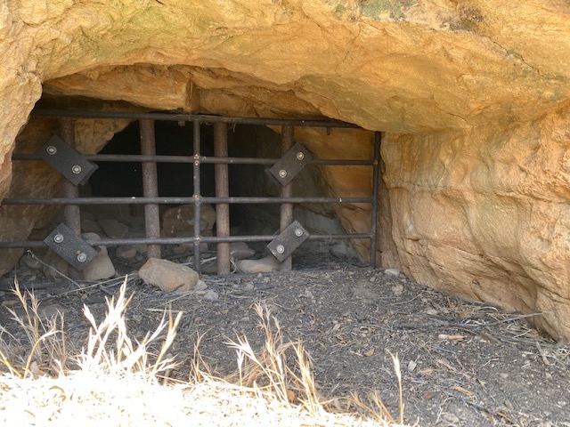 A barred-off entrance to a mine